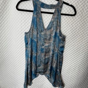 Barely worn. Unique neckline sleeveless top. Flattering and soft. Size Med